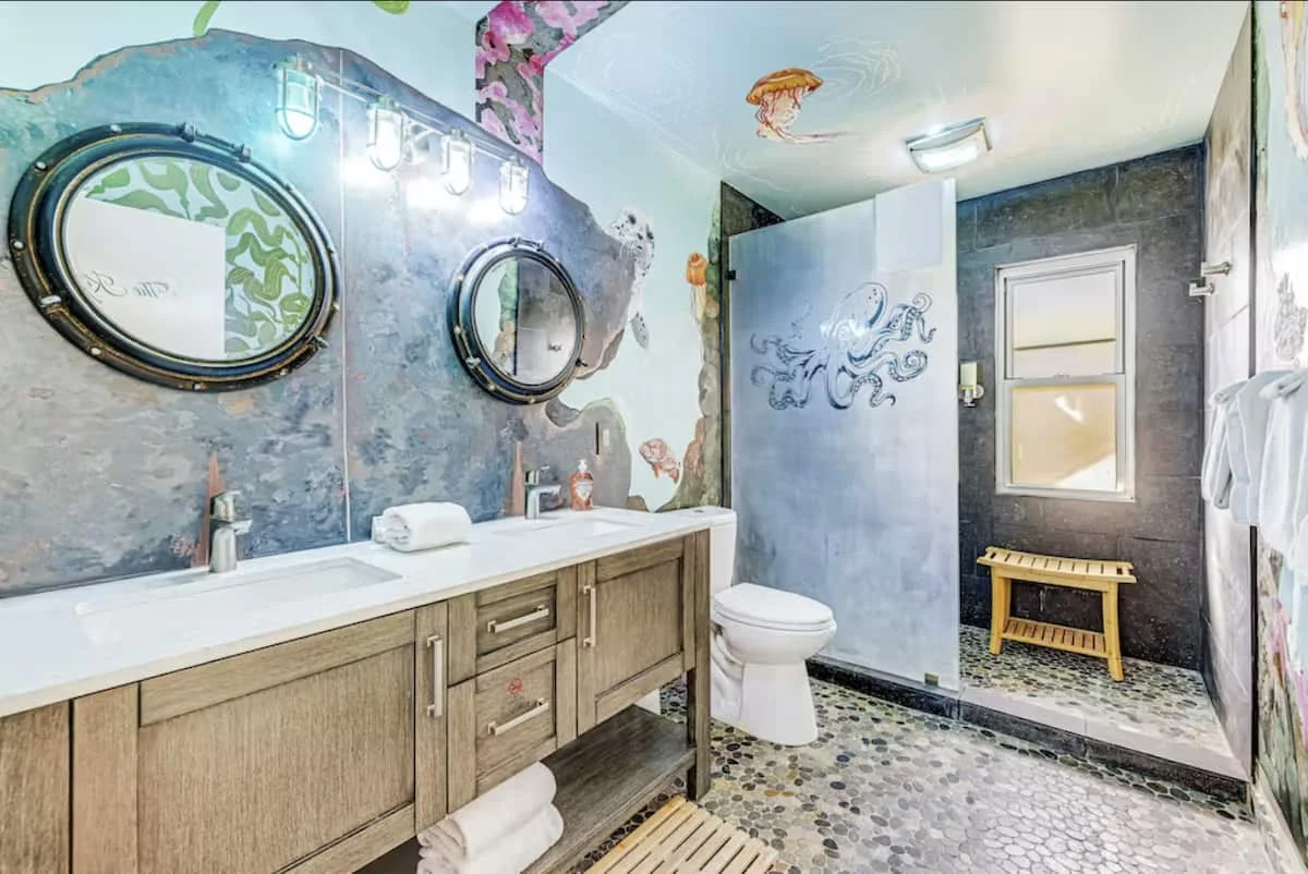 Interior of the Ocean View BNB — a custom ocean-themed room with hand-painted murals